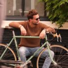 Mon Amour de Vélo Knit Pullover by Classycles, featuring a delicate embroidered classic road bike, perfect for cycling enthusiasts who love stylish apparel.