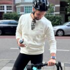 Model wearing the Mon Amour de Vélo Sweater by Classycles, showcasing a delicate embroidered road bike design, ideal for cyclists who cherish their journeys.